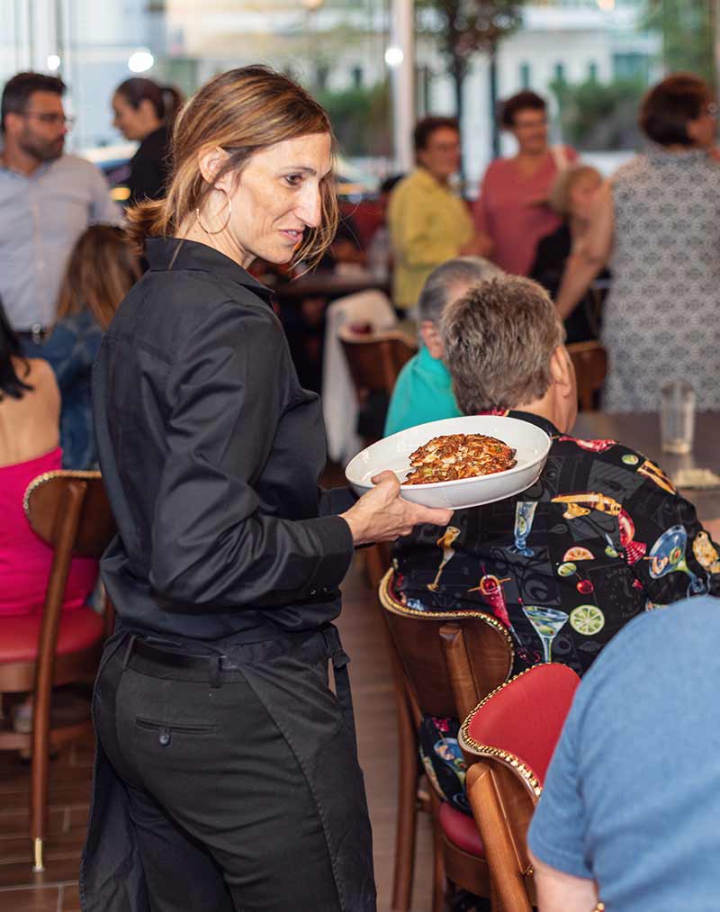 Waiter passing food at a private event in Chicago