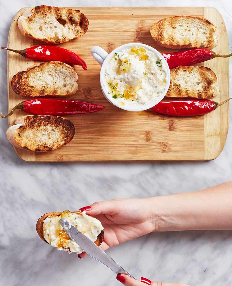 Whipped ricotta tuffo spread on baguette